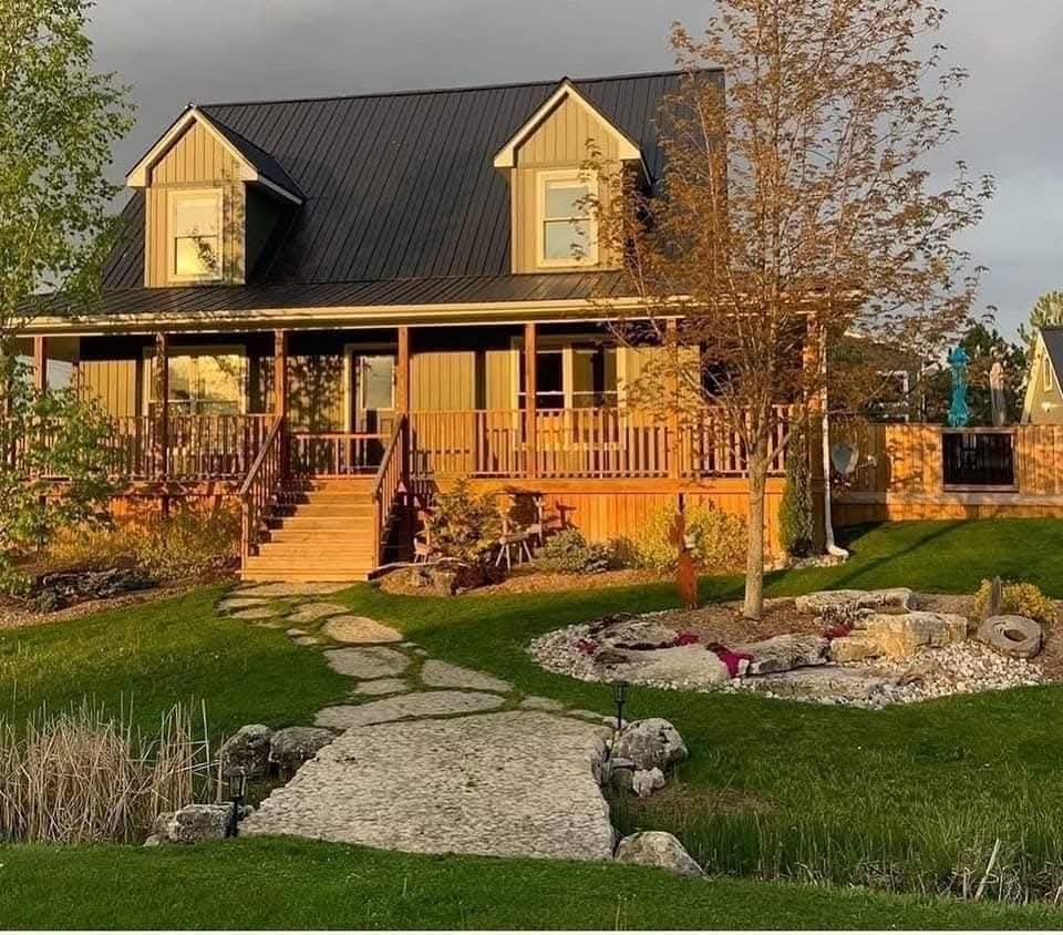 Cottage exterior with landscaped yard